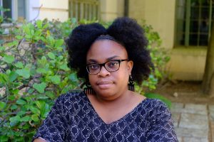 Professional headshot of Desiree S. Evans in front of shrubbery.